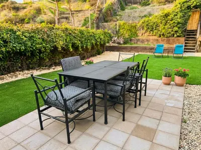 a black table and chairs on a patio at Pet friendly Spacious 3Bed with HUGE Back Yard in San Diego