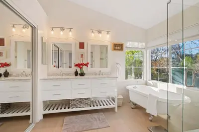 a white bathroom with a tub and a sink at Del Mar Deluxe Palace - Majestic - Iconic- Retreat in San Diego