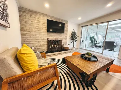 a living room with a couch and a coffee table at Comfortable 2Bed in Duplex with private Sunroom in San Diego