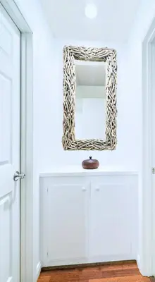 a mirror on top of a white cabinet in a room at Del Mar Coastal Haven in San Diego