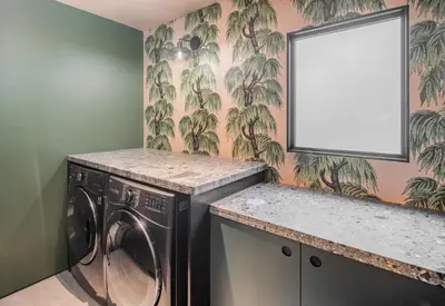 a laundry room with a washing machine and a mirror at Nord Moonlight Beach Luxury Home in Encinitas