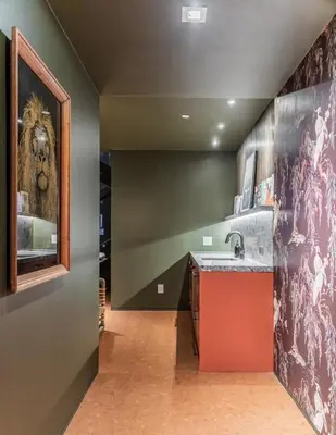 a kitchen with a lion painting on the wall at Nord Moonlight Beach Luxury Home in Encinitas