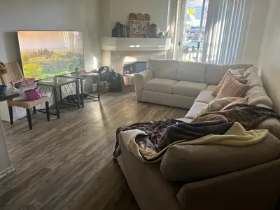 a living room with a couch and a table at Private stay SD in San Diego