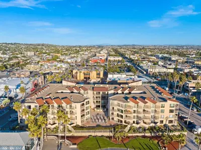 an aerial view of a city with buildings and palm trees at Penthouse at Pacific Beach Crystal Pier in San Diego