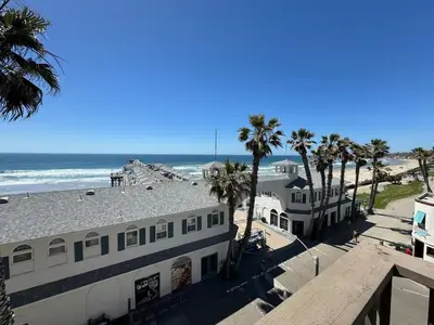 a view of the beach from the roof of a building at Penthouse at Pacific Beach Crystal Pier in San Diego