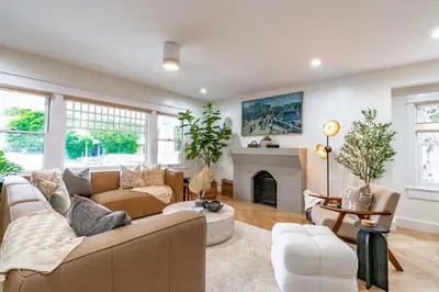 a living room with a couch and a fireplace at Gorgeous 2bd 2ba House - Balboa Park Zoo Downtown in San Diego
