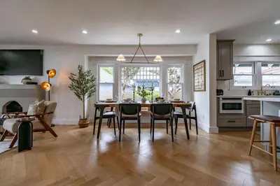 a kitchen and dining room with a table and chairs at Gorgeous 2bd 2ba House - Balboa Park Zoo Downtown in San Diego