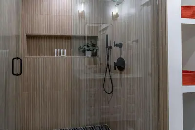 a bathroom with a shower with a glass door at Gorgeous 2bd 2ba House - Balboa Park Zoo Downtown in San Diego