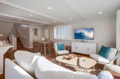a living room with a white couch and a table at The Shores 8 in San Diego