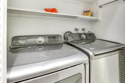 a kitchen with a washing machine and a sink at Waterfront Condo with Dock Access in Carlsbad! in Carlsbad