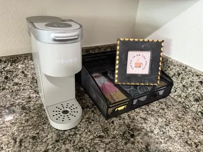 a white blender sitting on a counter next to a box at San Diego Skyline in San Diego