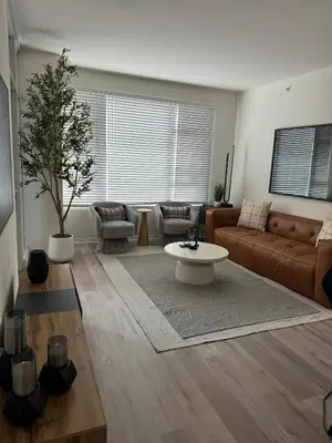 a living room with a couch and a table at San Diego Skyline in San Diego