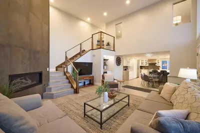 a living room with a couch and a fireplace at Ocean Front Walk in San Diego