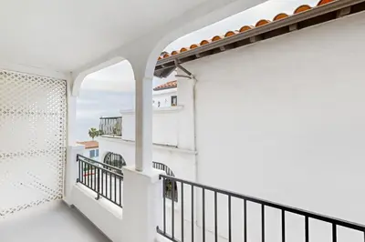a balcony with white walls and an archway at Cozy Couples Escape! Walk to San Clemente Pier in San Clemente