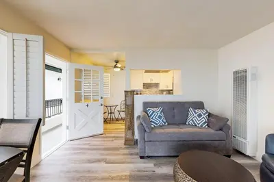 a living room with a couch and a table at Cozy Couples Escape! Walk to San Clemente Pier in San Clemente
