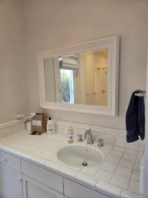 a bathroom with a sink and a mirror at Relaxing Countryside Resort Guest House in Poway