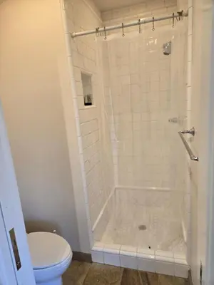a bathroom with a shower and a toilet at Relaxing Countryside Resort Guest House in Poway
