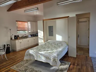 a bedroom with a bed in the middle of a kitchen at Relaxing Countryside Resort Guest House in Poway