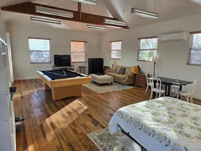 a room with a pool table and a living room at Relaxing Countryside Resort Guest House in Poway