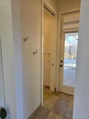 an empty hallway with a door and a window at Relaxing Countryside Resort Guest House in Poway
