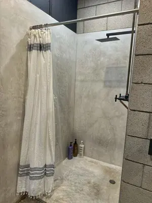 a shower with a shower curtain in a bathroom at Laguna Beach Best Kept Secret Complete Ocean View in Laguna Beach