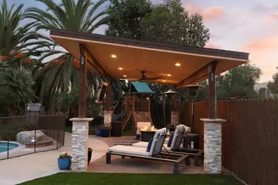a pavilion with chairs and a table next to a pool at Stunning Private Resort with Pool in San Marcos