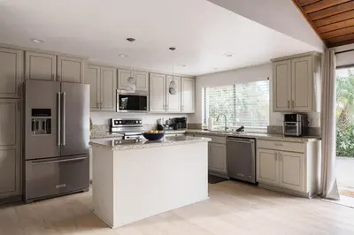 a kitchen with white cabinets and stainless steel appliances at Stunning Private Resort with Pool in San Marcos