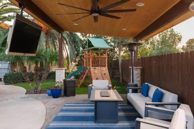a patio with a couch and a playground at Stunning Private Resort with Pool in San Marcos