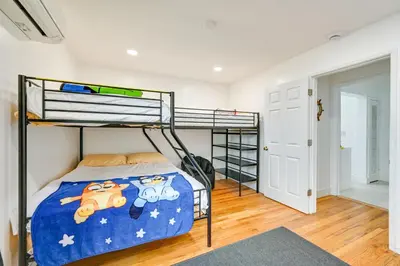 a bedroom with bunk beds in a house at House Kitsune - Steps to Beach in Oceanside