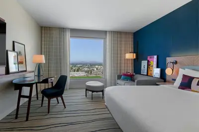 a hotel room with a bed and a desk at Gaylord Pacific Resort & Convention Center in Chula Vista