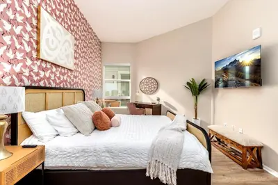 a bedroom with a bed with two teddy bears on it at Eclectic Fast Wi-Fi Parking Pets Bohemian in San Diego
