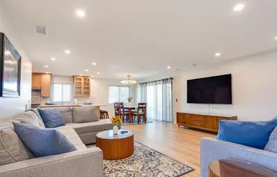 a living room with a couch and a tv at Newly Remodeled Home in Escondido