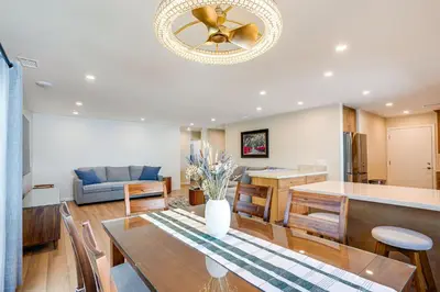 a dining room and living room with a ceiling fan at Newly Remodeled Home in Escondido