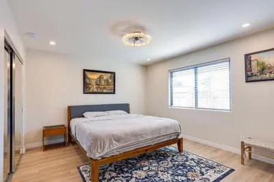 a bedroom with a bed and a window at Newly Remodeled Home in Escondido