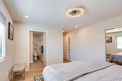 a bedroom with a bed and a ceiling fan at Newly Remodeled Home in Escondido