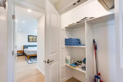 a hallway with a door leading to a bedroom at Newly Remodeled Home in Escondido
