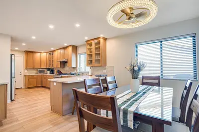 a kitchen and dining room with a table and chairs at Newly Remodeled Home in Escondido