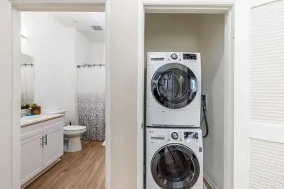 a laundry room with two washer and dryer at Artistic FastWiFi Parking Pets in San Diego