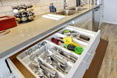 an open drawer in a kitchen with utensils at Coastal Escape King 1Bd, Pets Parking Fast Wi-Fi in San Clemente