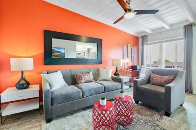 a living room with a couch and a chair at Coastal Escape King 1Bd, Pets Parking Fast Wi-Fi in San Clemente