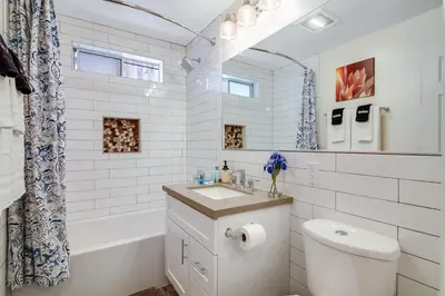 a bathroom with a sink and a toilet and a tub at Coastal Escape King 1Bd, Pets Parking Fast Wi-Fi in San Clemente