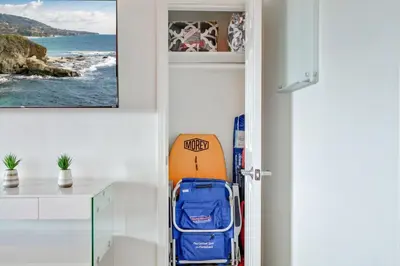 a room with a door with a surfboard in it at Coastal Escape King 1Bd, Pets Parking Fast Wi-Fi in San Clemente