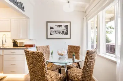 a dining room with a glass table and chairs at Gorgeous Retreat Close to Beach and Downtown in San Clemente