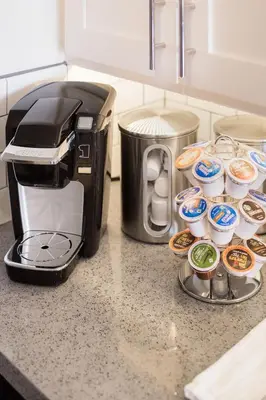 a toaster and muffins on a counter in a kitchen at Gorgeous Retreat Close to Beach and Downtown in San Clemente