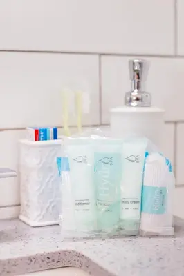 a group of toothbrushes and toothpaste on a counter at Gorgeous Retreat Close to Beach and Downtown in San Clemente