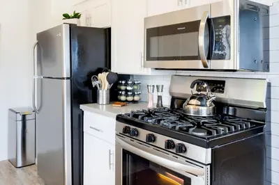 a kitchen with a stove and a refrigerator at Seaside King 1bd Haven, Pets, Fast Wi-Fi Parking in San Clemente