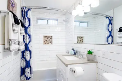 a white bathroom with a sink and a tub at Seaside King 1bd Haven, Pets, Fast Wi-Fi Parking in San Clemente