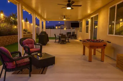 a screened porch with a pool table and chairs at 6 BR Pool & Games Retreat - Summer Near Wineries in Winchester