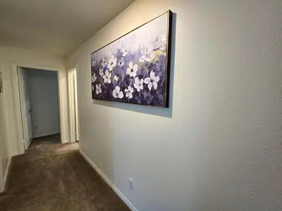 a painting hanging on a wall in a room at 6 BR Pool & Games Retreat - Summer Near Wineries in Winchester