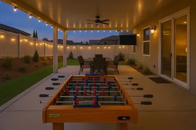a backyard with a foosball table on a patio at 6 BR Pool & Games Retreat - Summer Near Wineries in Winchester